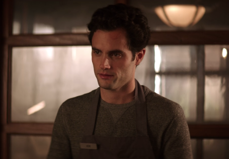 joe wearing a grey shirt and an apron 